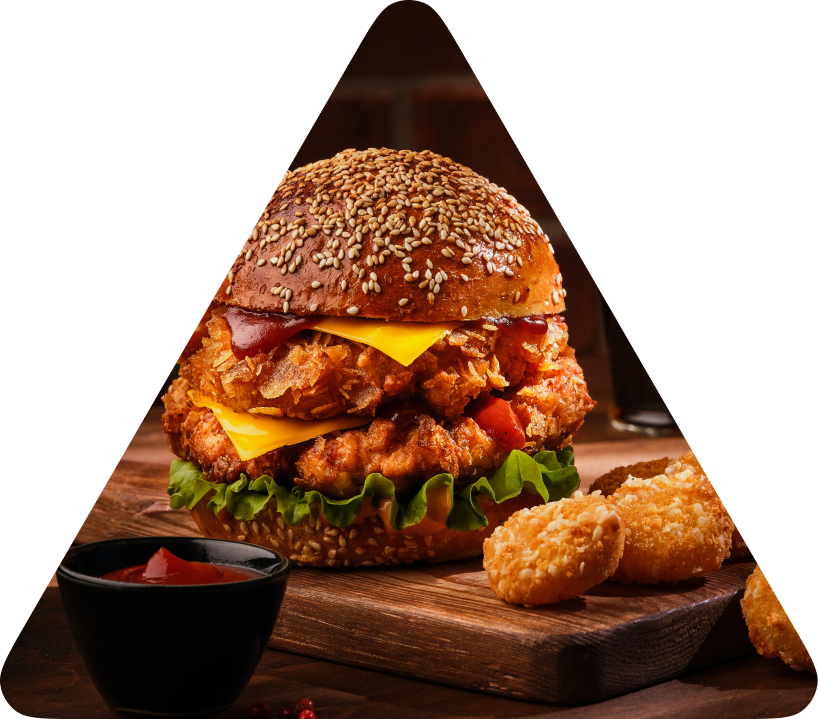 Burger and sides on a wooden board